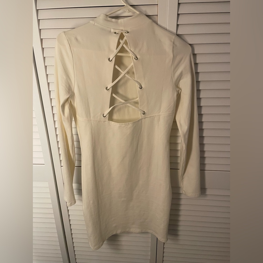 Brand new white long sleeve, open back dress